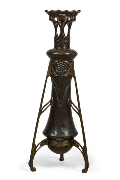 Art Nouveau bronze floor vase supported by 3 open design legs