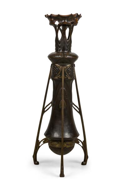 Art Nouveau bronze floor vase supported by 3 open design legs