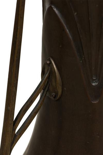 Art Nouveau bronze floor vase supported by 3 open design legs