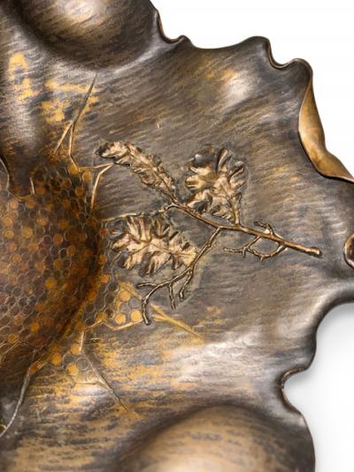Art Nouveau patinaed brass scalloped basket with insect and handle
