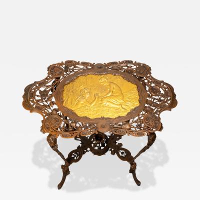 Art Nouveau patinated and gilt cast iron side table