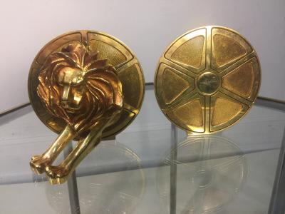 Arthus Bertrand EXCEPTIONAL GILDED BRONZE LION AND FILM REEL BOOKENDS
