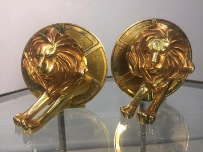 Arthus Bertrand EXCEPTIONAL GILDED BRONZE LION AND FILM REEL BOOKENDS