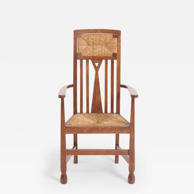 Arts Crafts Oak and Rush Armchair