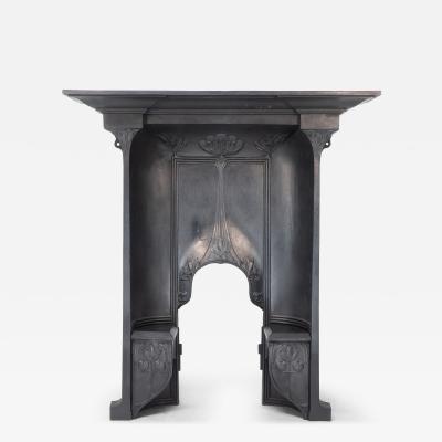 Arts Crafts cast iron fireplace with curved sides stylized floral decoration