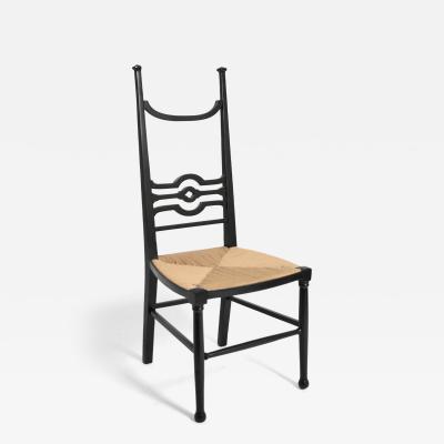 Arts Crafts ebonised wood fireside chair 1900s 