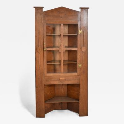 Arts and Crafts oak corner cabinet 1900s 
