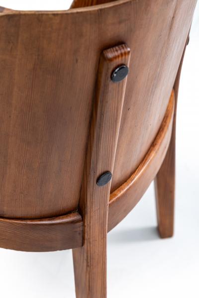 Axel Einar Hjorth Lovo armchair stained pine and iron rivets