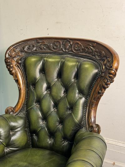 BEAUTIFUL ORNATELY CARVED WOOD AND BUTTON TUFTED LEATHER ARMCHAIR