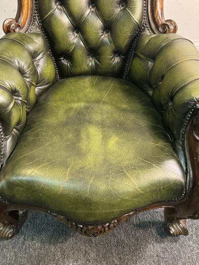 BEAUTIFUL ORNATELY CARVED WOOD AND BUTTON TUFTED LEATHER ARMCHAIR