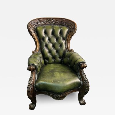 BEAUTIFUL ORNATELY CARVED WOOD AND BUTTON TUFTED LEATHER ARMCHAIR