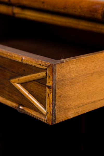 Bamboo 2 door cabinet with bone trim and side shelves and a back rail