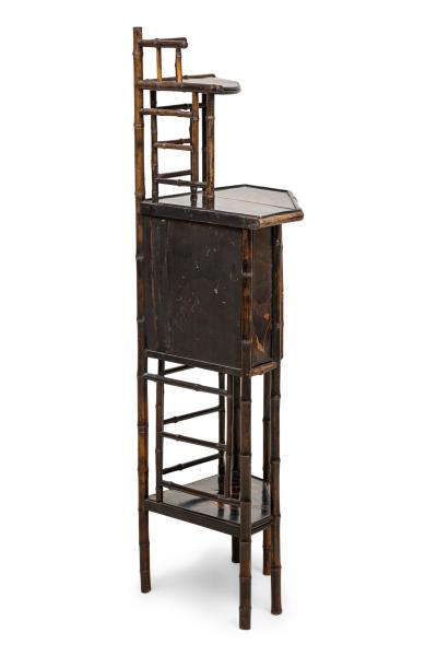 Bamboo and black lacquered decorated corner cabinet with door