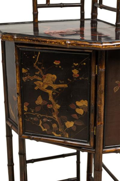 Bamboo and black lacquered decorated corner cabinet with door