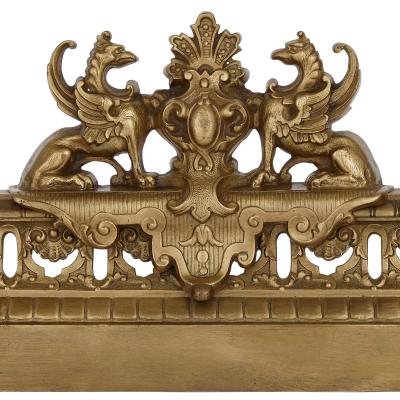 Baroque style pierced brass hearth fender
