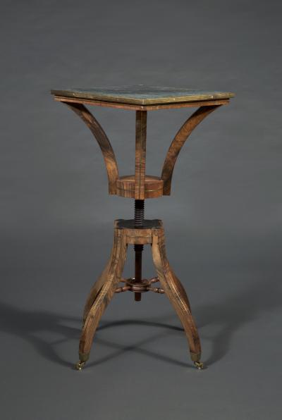 Brass inlaid rosewood center table possibly for the display of a sculpture