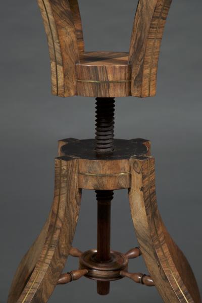 Brass inlaid rosewood center table possibly for the display of a sculpture