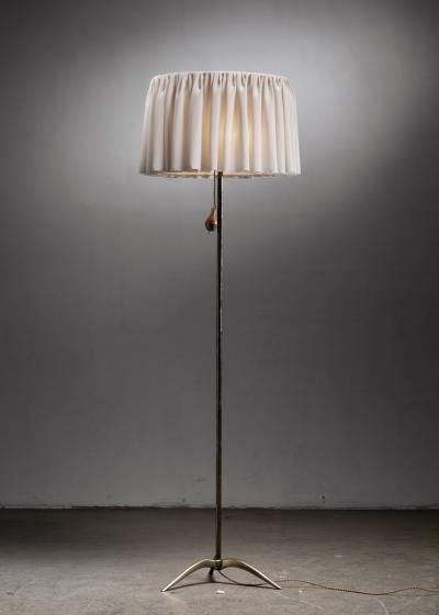 Brass tripod floor lamp