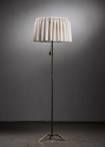 Brass tripod floor lamp