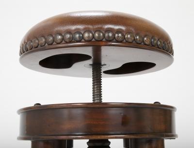Bronze Four Legged Adjustable Revolving Stool with Leather Upholstered Seat