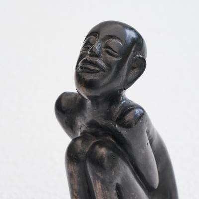 Bronze Sculpture of a Sitting Man