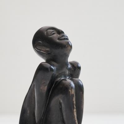 Bronze Sculpture of a Sitting Man