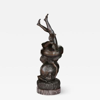Bronze figurative sculpture of Amor with a dolphin