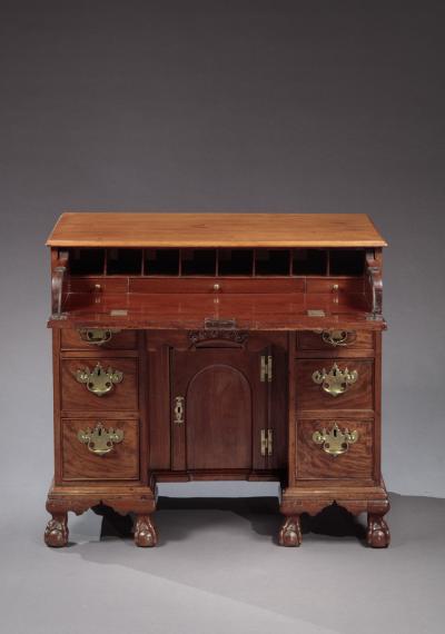 CHIPPENDALE KNEEHOLE DESK WITH BALL AND CLAW FEET AND A CARVED DRAWER