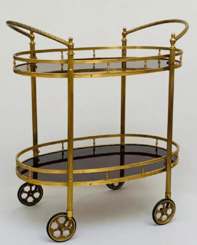 CIRCA 1960 TWO TIERED OVAL BRASS SERVING TROLLEY