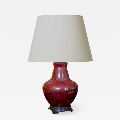 Carl Halier Exquisite table lamp in oxblood glaze with bronze mounts by Carl Halier