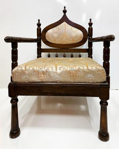 Carved End of Indo British Colonial Period Lounge Chairs Pair