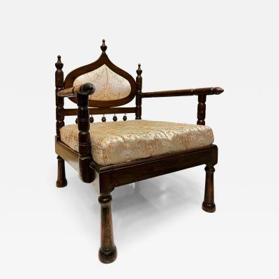 Carved End of Indo British Colonial Period Lounge Chairs Pair