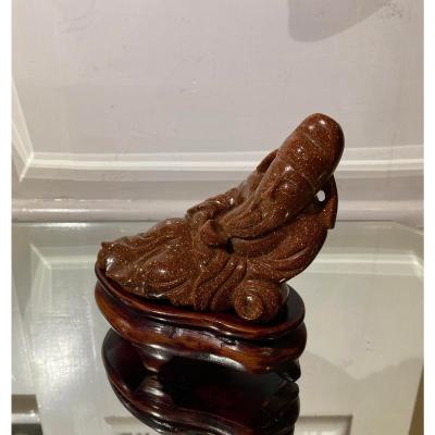 Carved Goldstone Sculpture of Recumbent Buddha