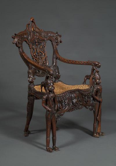 Carved Indian Rosewood Armchair With Legs In The Form Of Standing Soldiers