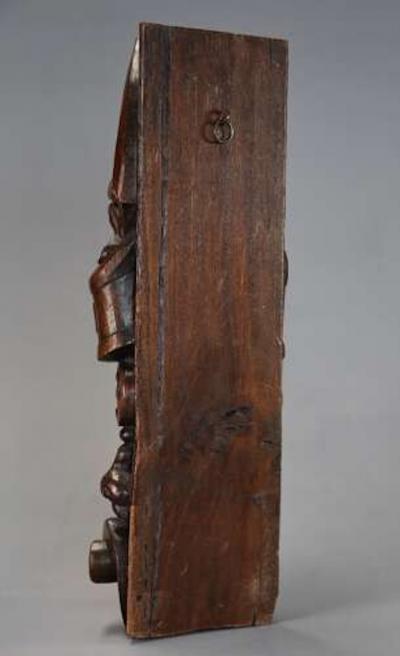 Carved oak corbel in the style of a Medieval man possibly Continental