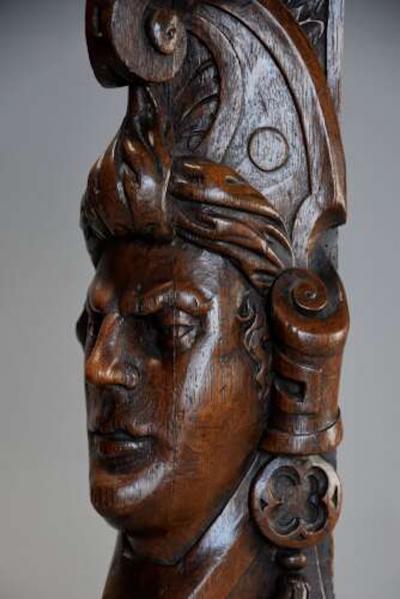 Carved oak corbel in the style of a Medieval man possibly Continental