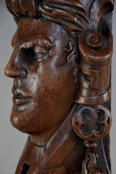 Carved oak corbel in the style of a Medieval man possibly Continental