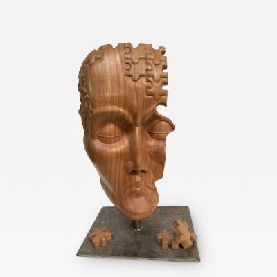 Carved wood puzzle head sculpture