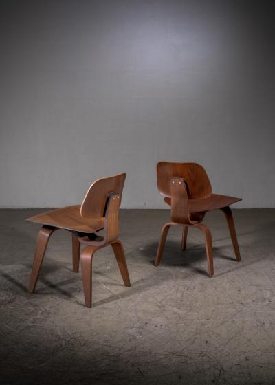 Charles Ray Eames Pair of Eames DCW walnut by Herman Miller
