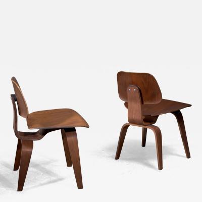 Charles Ray Eames Pair of Eames DCW walnut by Herman Miller