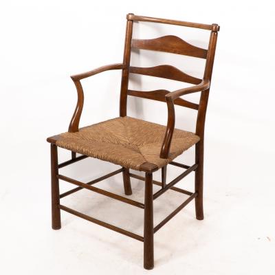 Charles Robert Ashbee C R Ashbee An Arts Crafts Rush Seat Ladder Back Armchair
