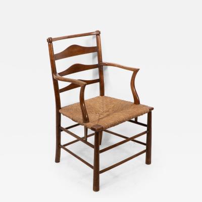 Charles Robert Ashbee C R Ashbee An Arts Crafts Rush Seat Ladder Back Armchair