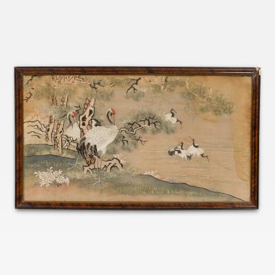 Chinese silk embroidery of herons on land and lake in a mahogany frame