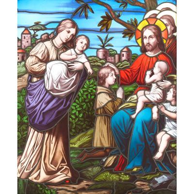 Christian stained glass window of Christ blessing children