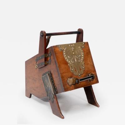Christopher Dresser Dr C Dresser An Aesthetic Movement Walnut Coal Box with Stylized Brass Panels
