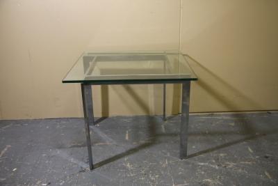 Chrome and glass side table in the manner of Milo Baughman