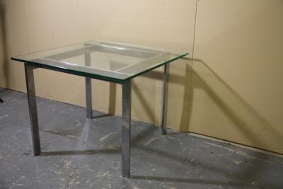 Chrome and glass side table in the manner of Milo Baughman