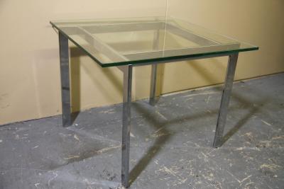 Chrome and glass side table in the manner of Milo Baughman