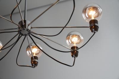 Chromed Steel Eight Arm Chandelier in the Style of Gino Sarfatti 1960s
