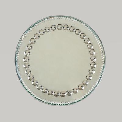 Circular 1900s sorcerers mirror tray stamped Made in England to back